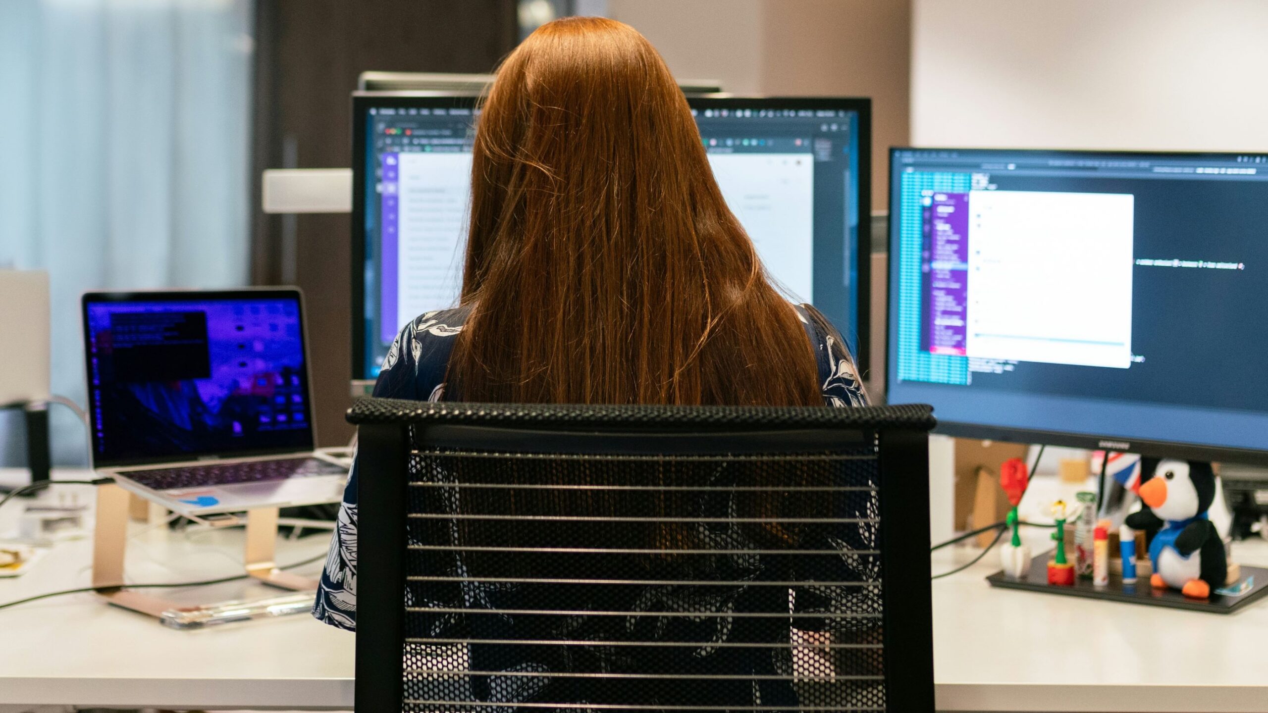 Woman using accelerators and tools at her work station